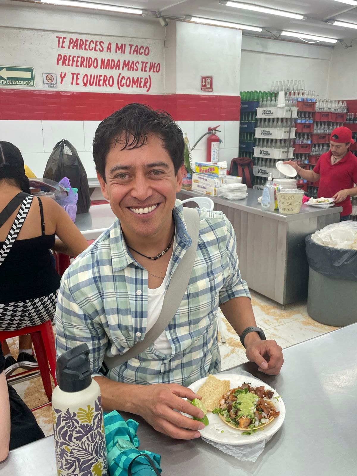 Chef Mauricio smiling with tacos